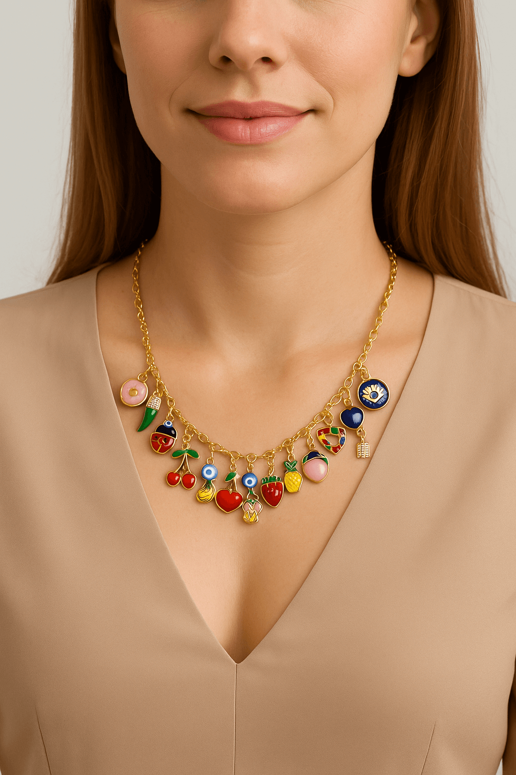 Collier a personnaliser featuring colorful fruit charms worn by a model with a neutral top.