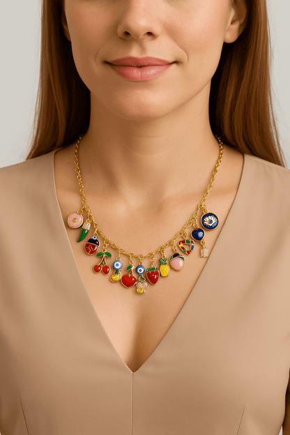 Collier a personnaliser featuring colorful fruit charms worn by a model with a neutral top.